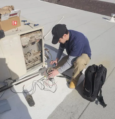 Frankie measuring airflow at vent