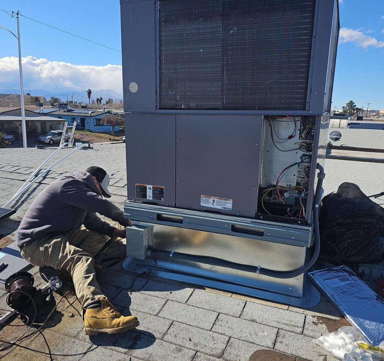 Constant Air Balancing technician working on a new commercial rooftop HVAC installation in Las Vegas, NV