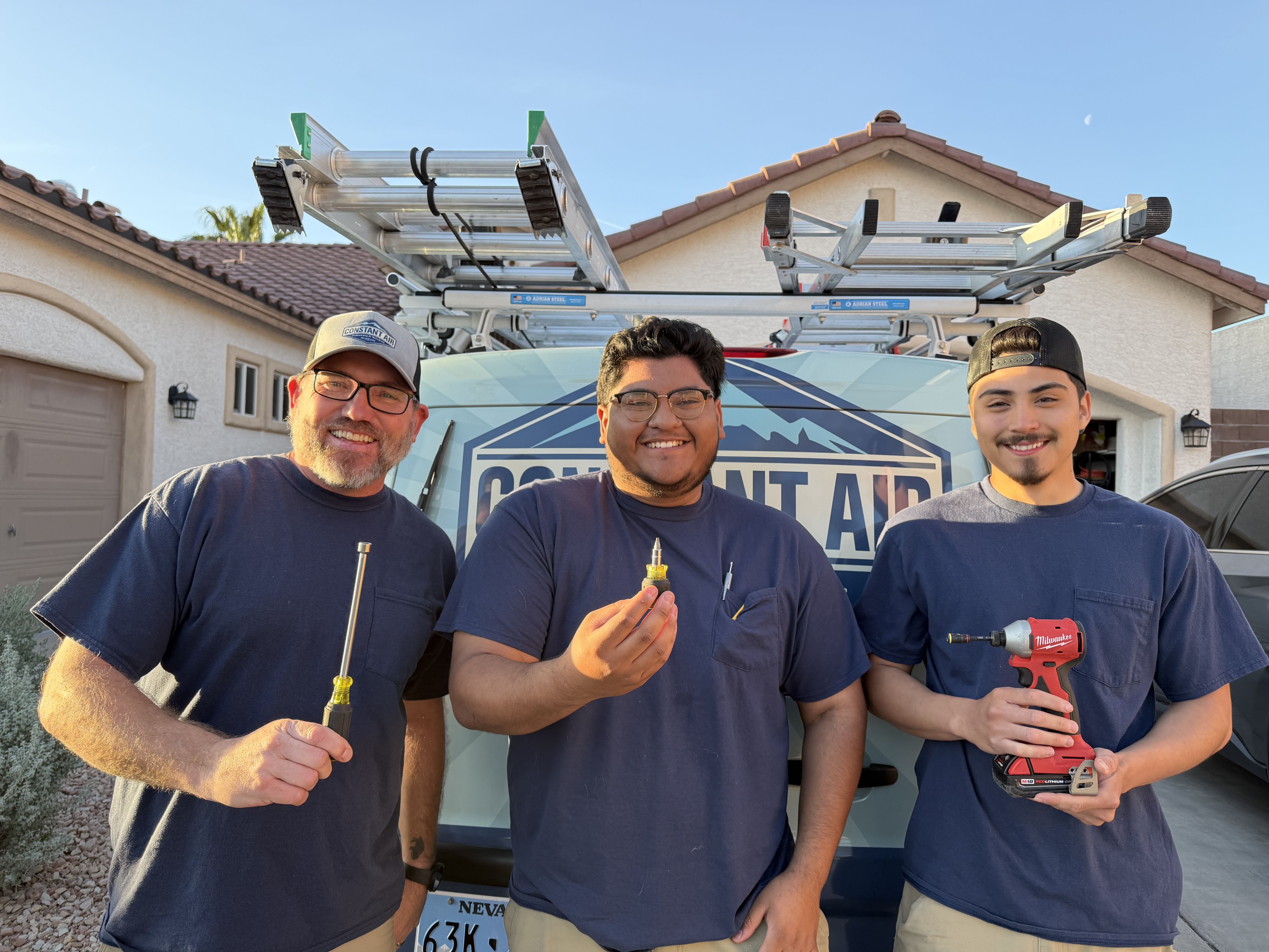 Constant Air Balancing team of three technicians with tools in front of the Constant Air Balancing branded service van in Las Vegas, NV