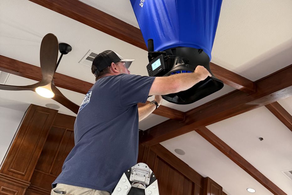 Constant Air technician measuring airflow inside a Las Vegas home before a whole-home humidifier installation