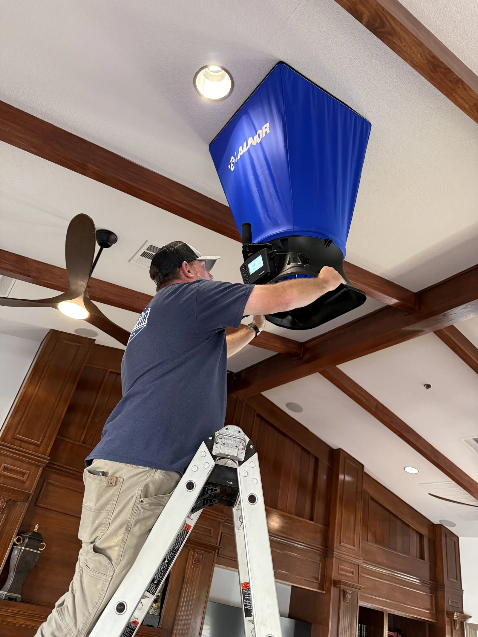 HVAC technician performing air balancing in Las Vegas home